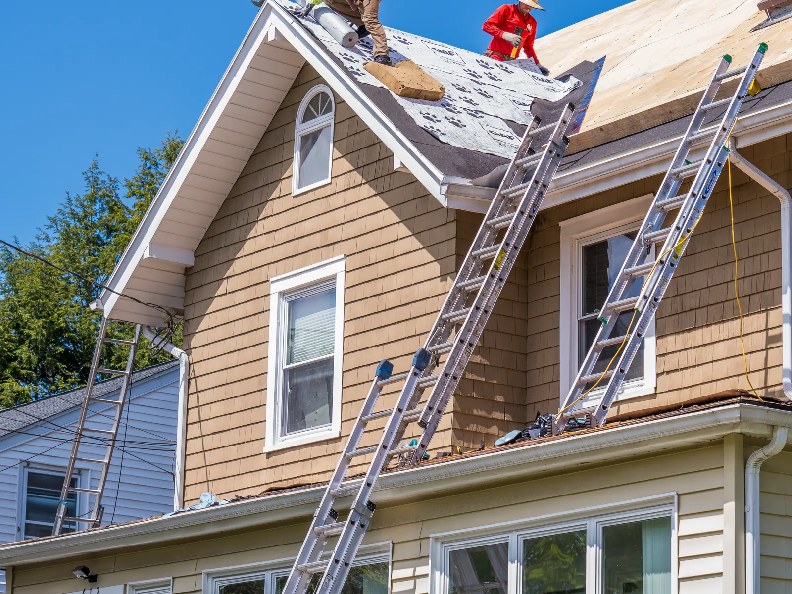 An A&J crew working on a roof replacement in New Jersey